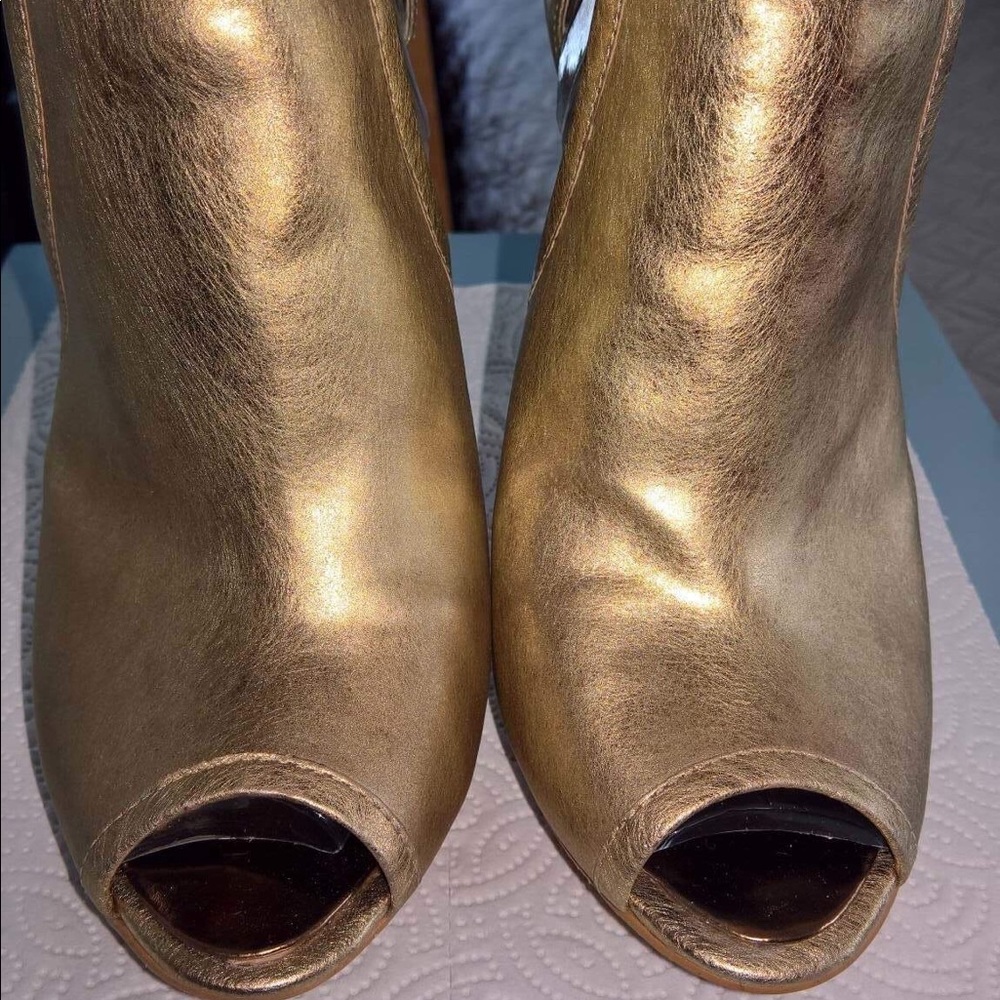 BCBG-Maxazria dark-gold leather shoe.